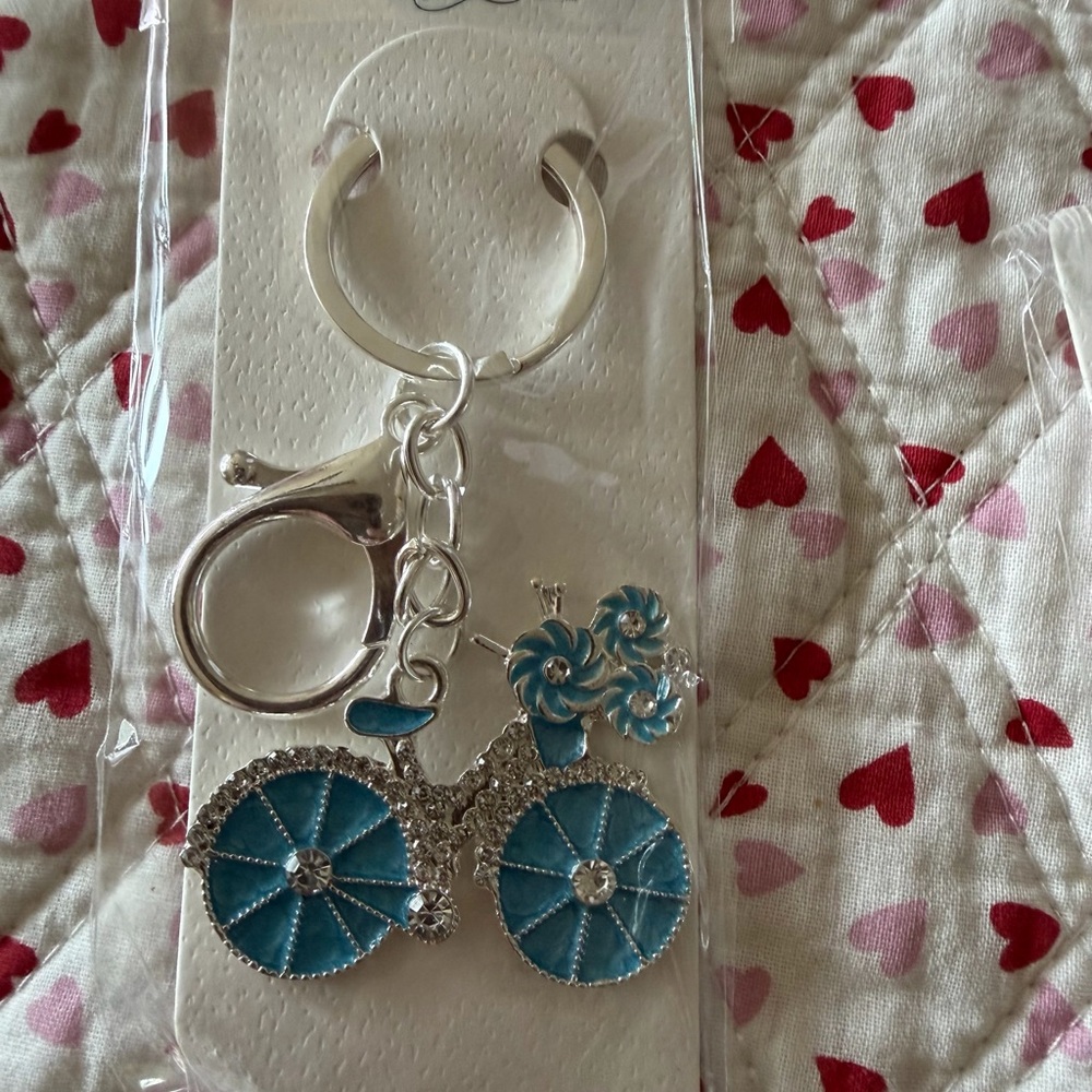 Silver and Blue Bicycle Keychain .